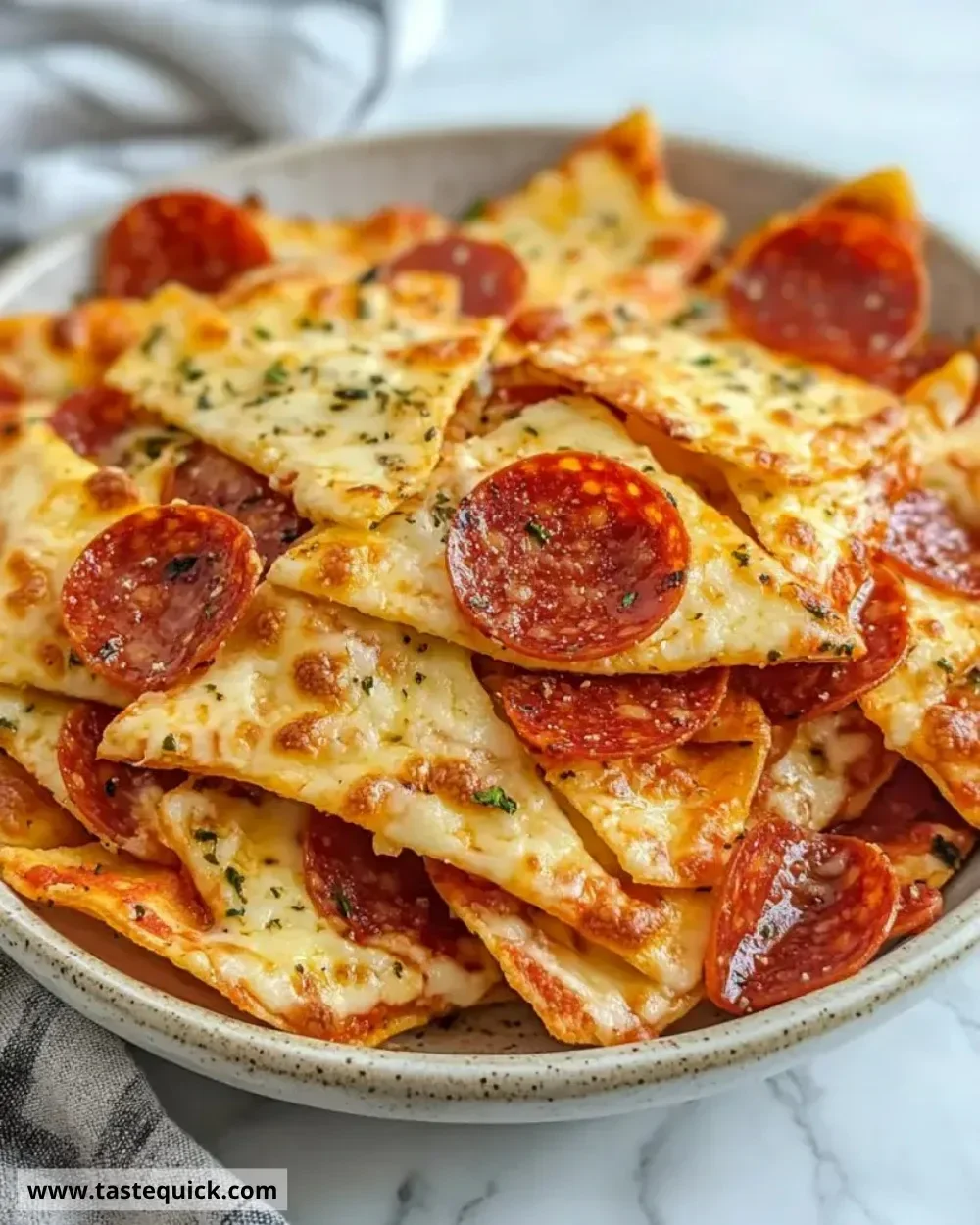 Homemade 2 ingredient pizza chips on a serving plate.