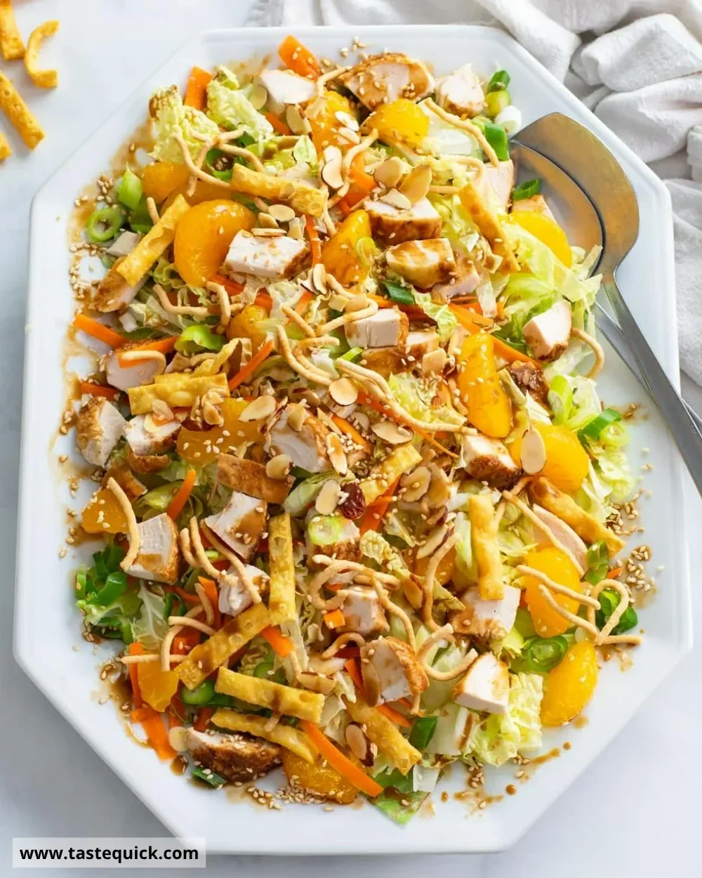 Bowl of vibrant Chinese Chicken Salad with colorful vegetables and sesame dressing