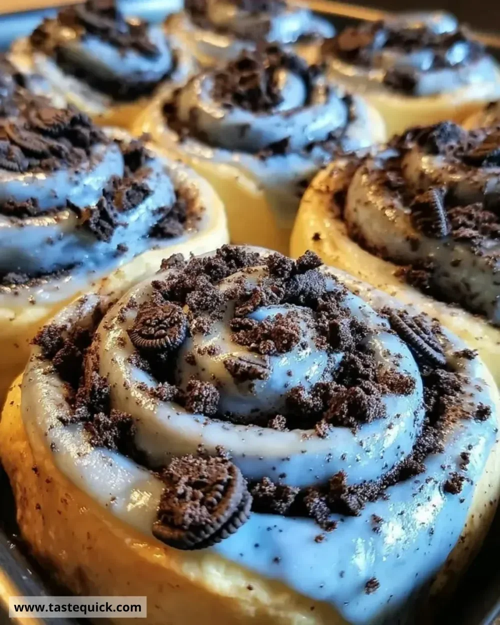 Delicious Cookie Monster Cinnamon Rolls topped with blue frosting and cookie pieces