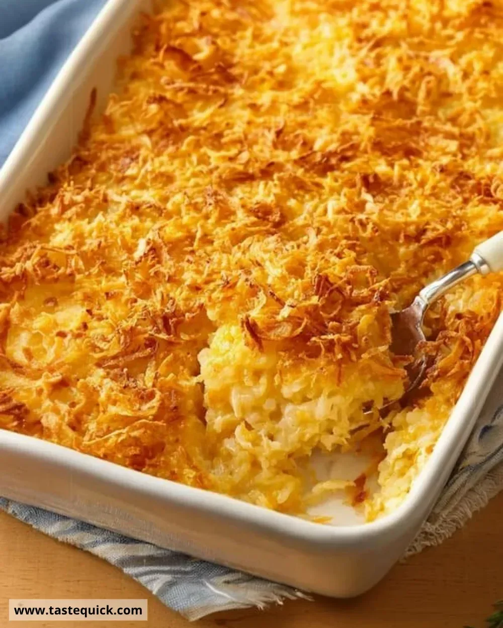 Delicious Cracker Barrel Hashbrown Casserole topped with cheese and crispy edges.