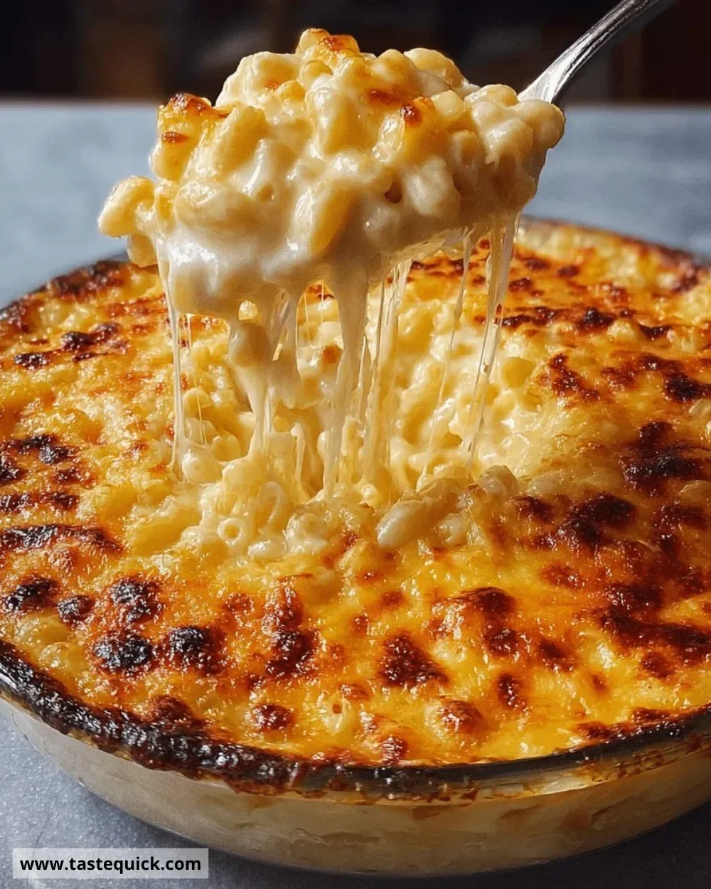 Creamy baked mac and cheese topped with golden breadcrumbs and sprinkled with herbs.