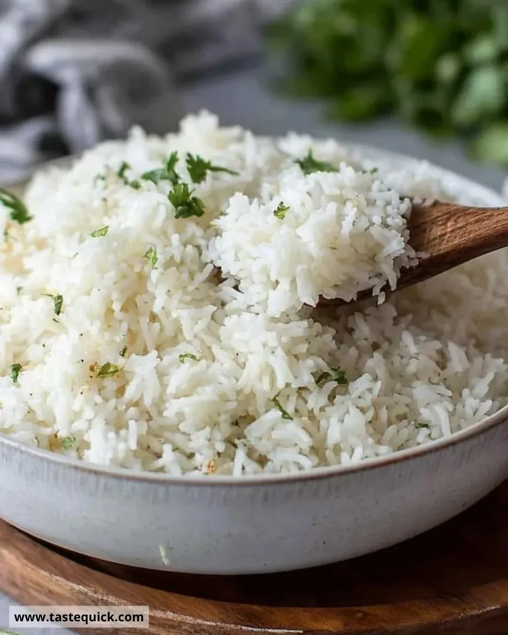 Bowl of creamy coconut rice garnished with herbs and spices