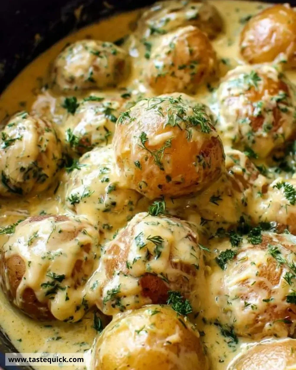 Creamy garlic sauce coated baby potatoes served on a plate