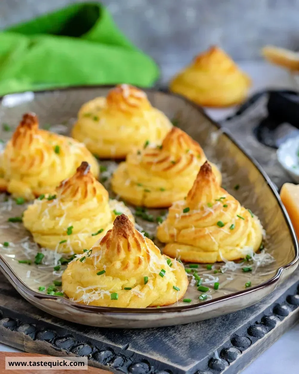 Deliciously baked Duchess Potatoes served elegantly on a plate