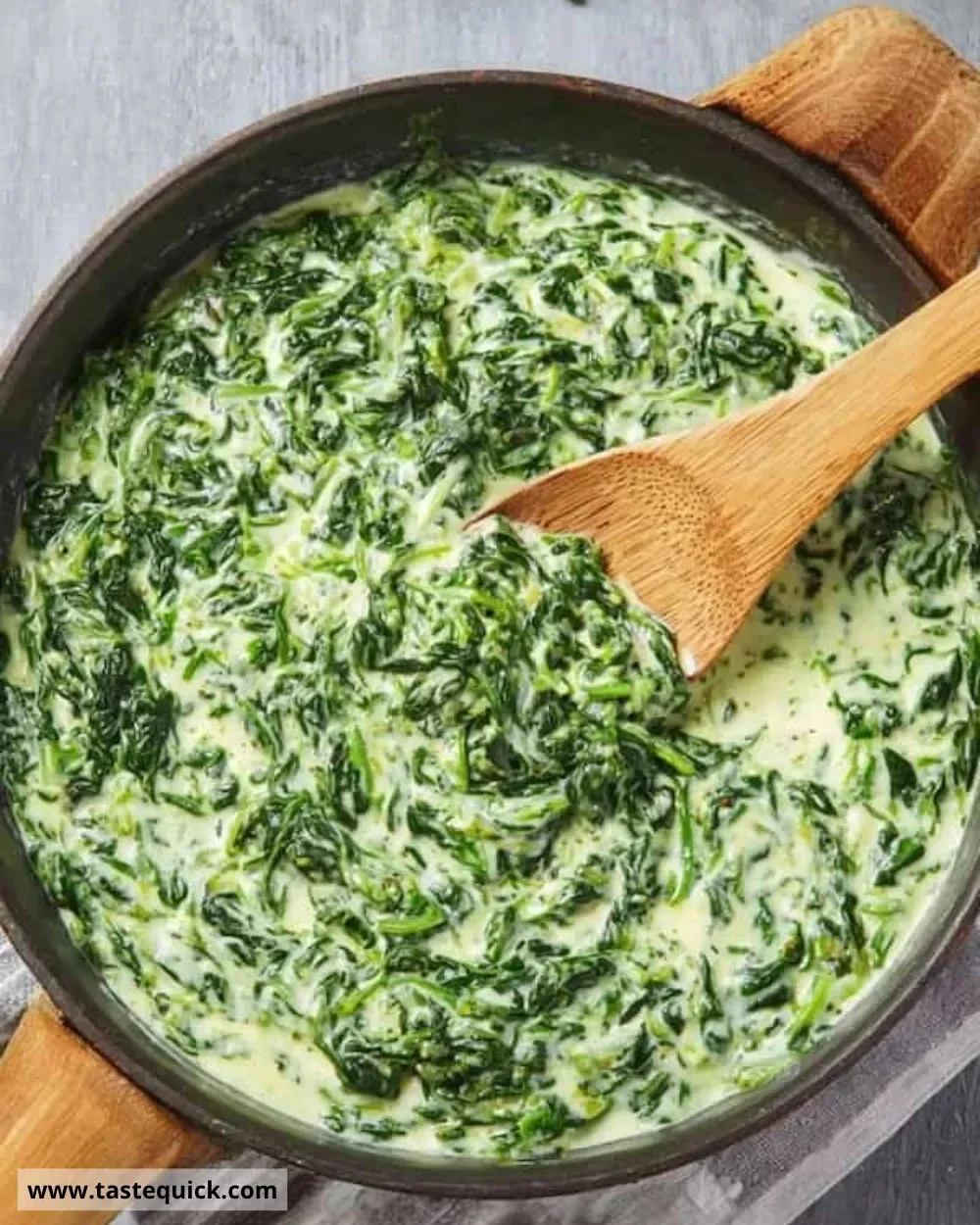Creamed spinach served in a bowl, garnished and ready to enjoy.