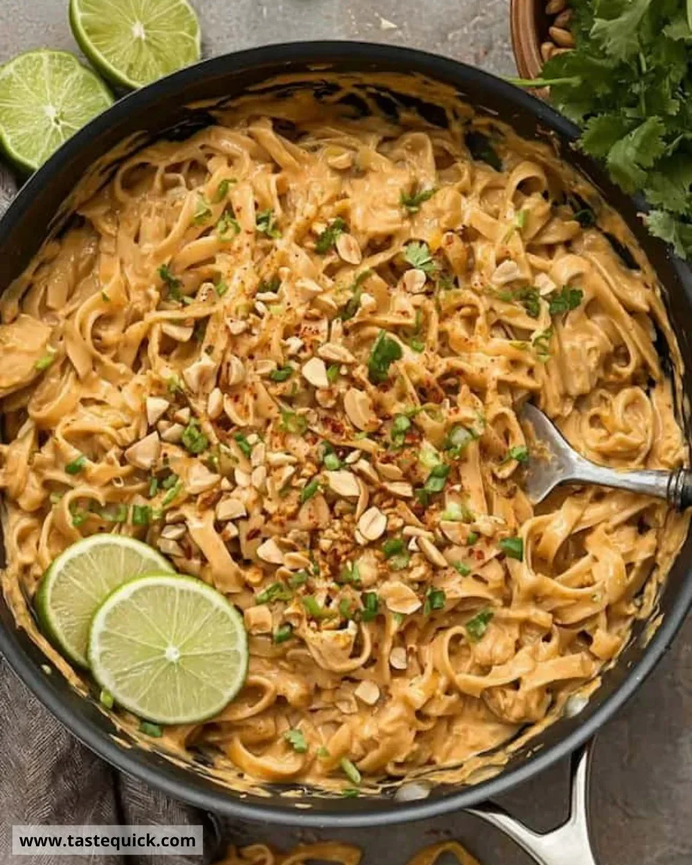 Bowl of easy peanut noodles topped with vegetables and peanuts