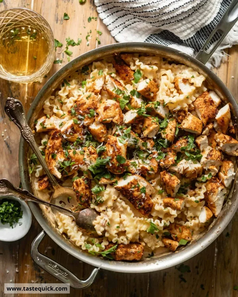 Bowl of Garlic Parmesan Chicken Pasta with fresh herbs and parmesan cheese