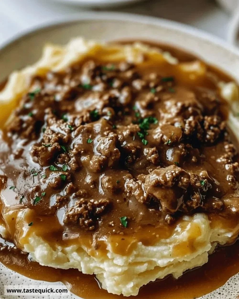 Ground beef and gravy served over creamy mashed potatoes