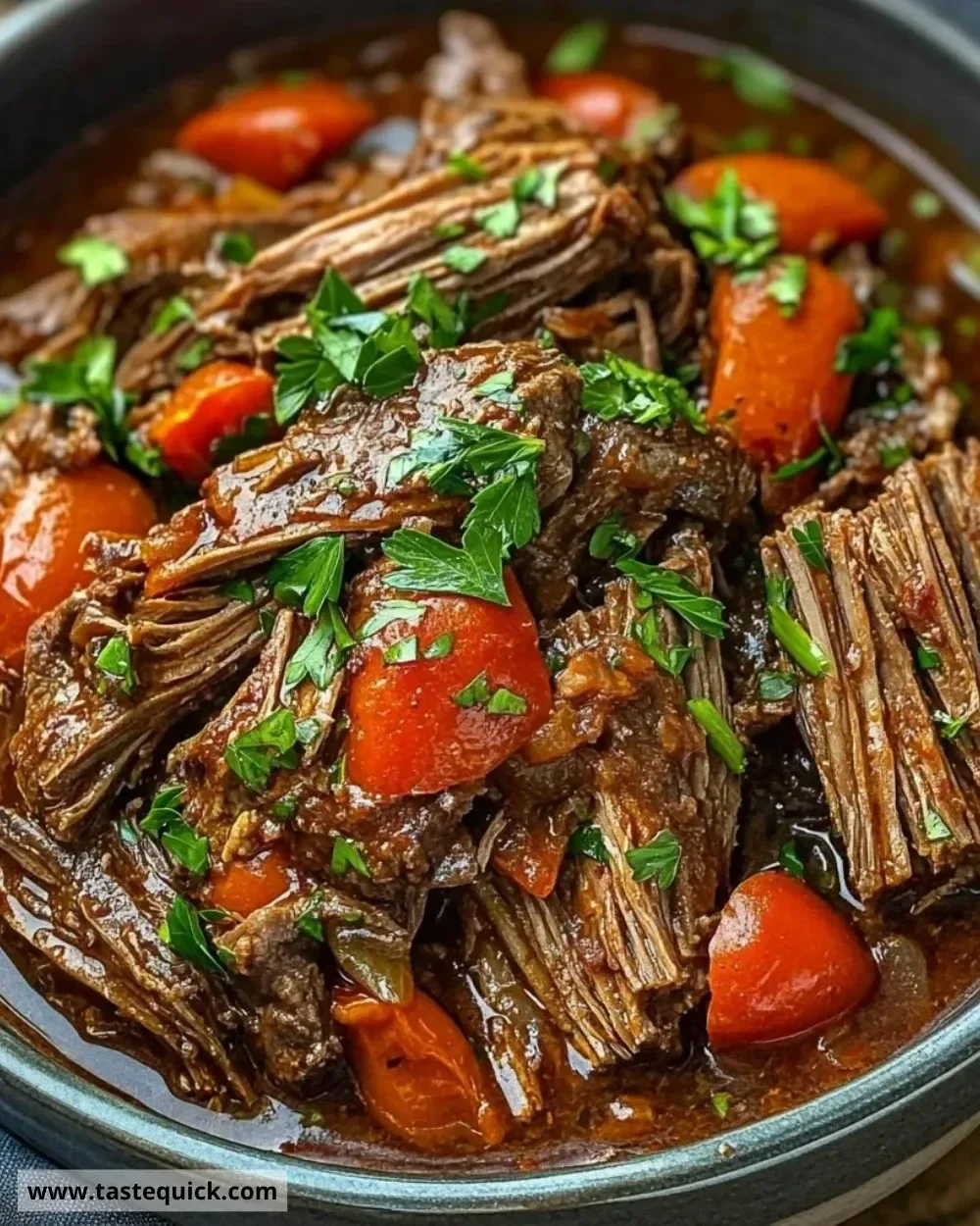 Delicious Italian Beef Pot Roast served with vegetables and herbs.