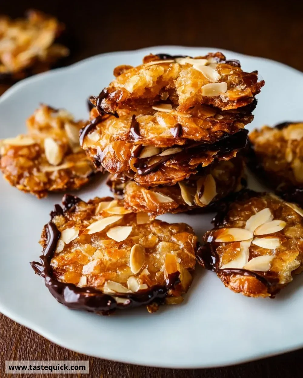 Delicious quick Florentines with nuts and chocolate on a plate.