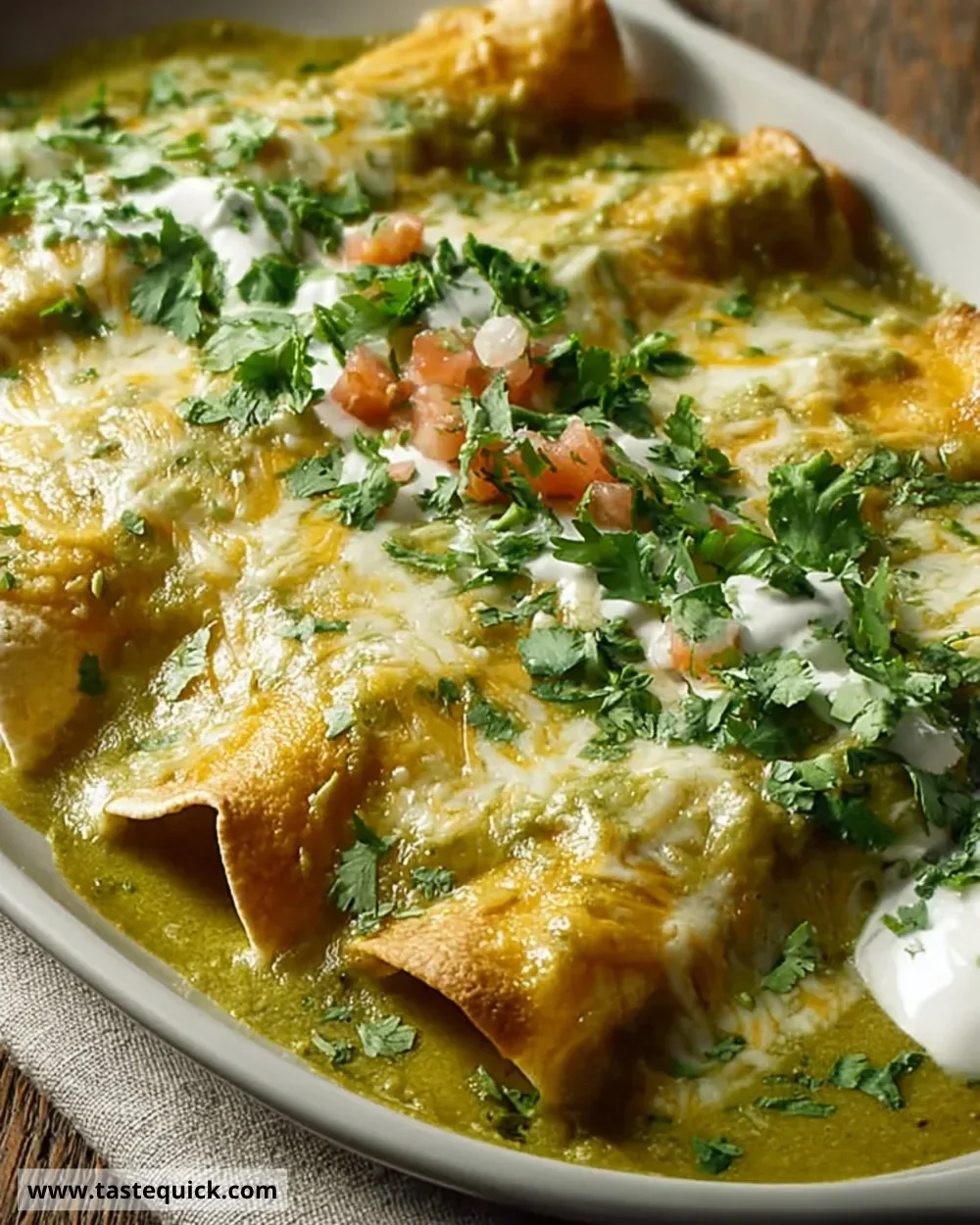 Plate of Swiss Enchiladas served with toppings and sides