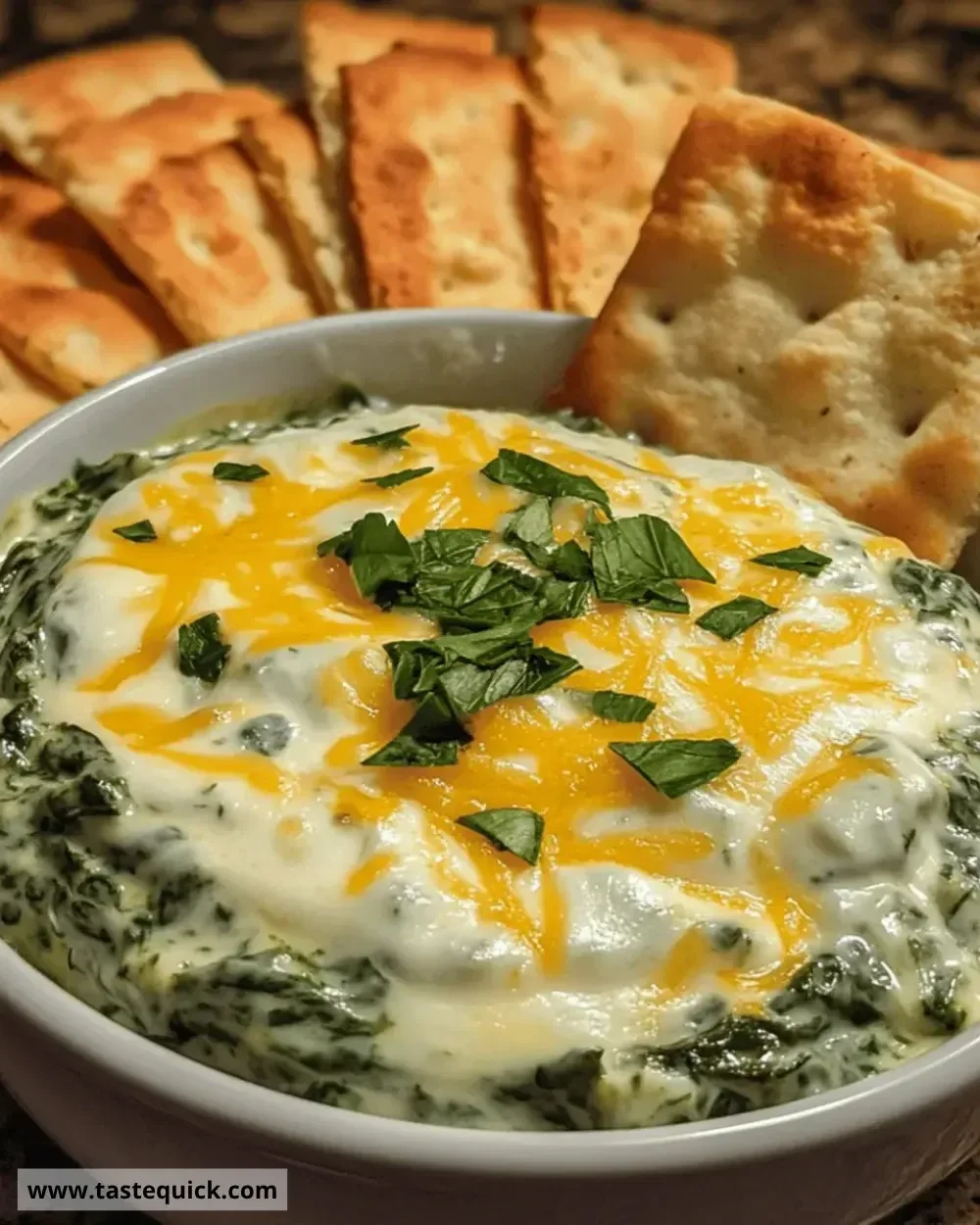 Delicious creamy spinach cheese dip served with tortilla chips