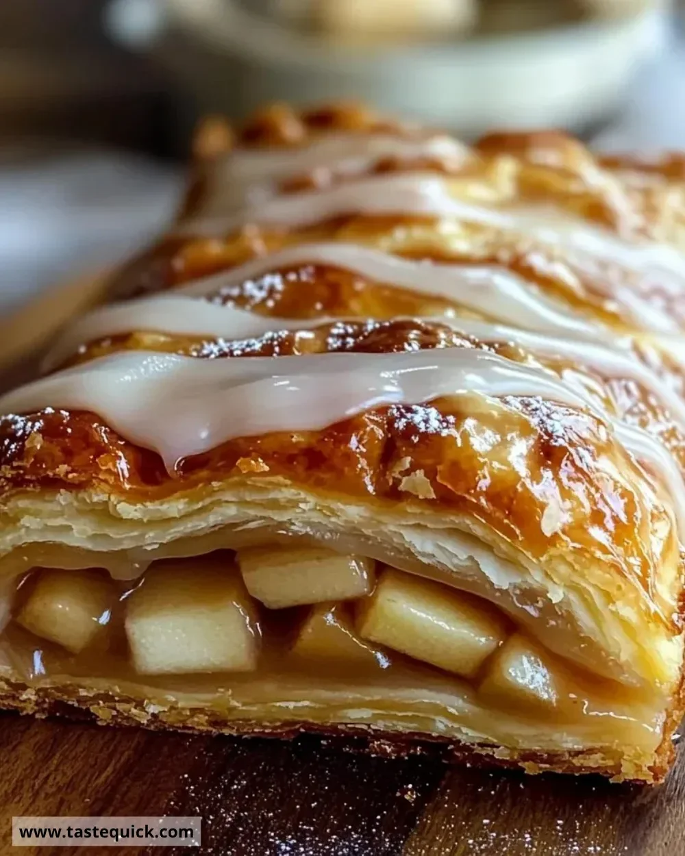 Delicious Wisconsin Apple Kringle with apples and cinnamon on a wooden table