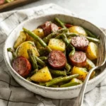 Sheet pan sausage with potatoes and green beans ready to serve