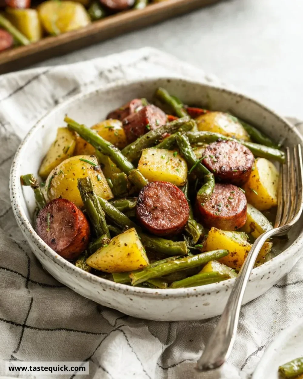 Sheet pan sausage with potatoes and green beans ready to serve