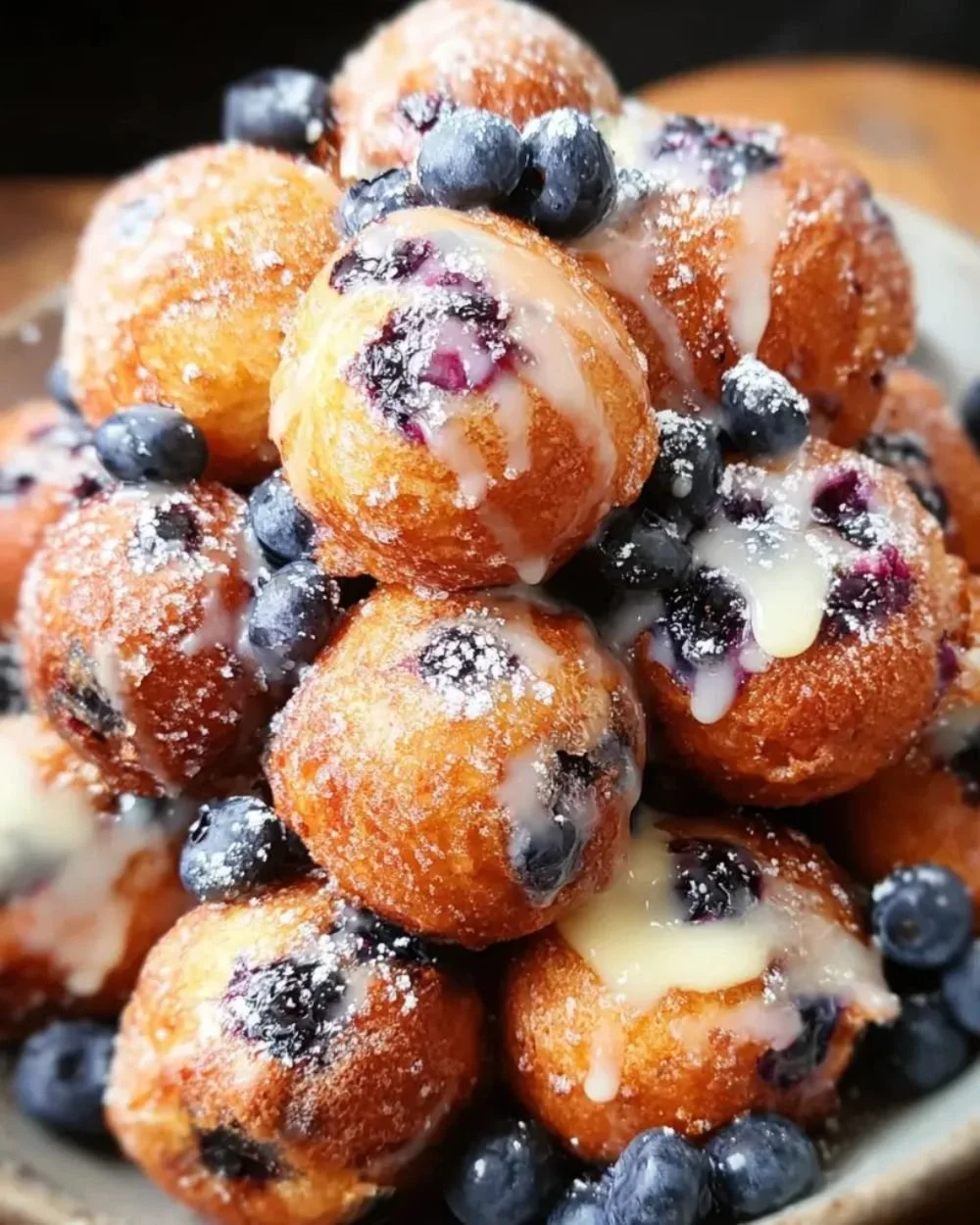 Baked blueberry fritter bites with fresh blueberries and a crispy exterior