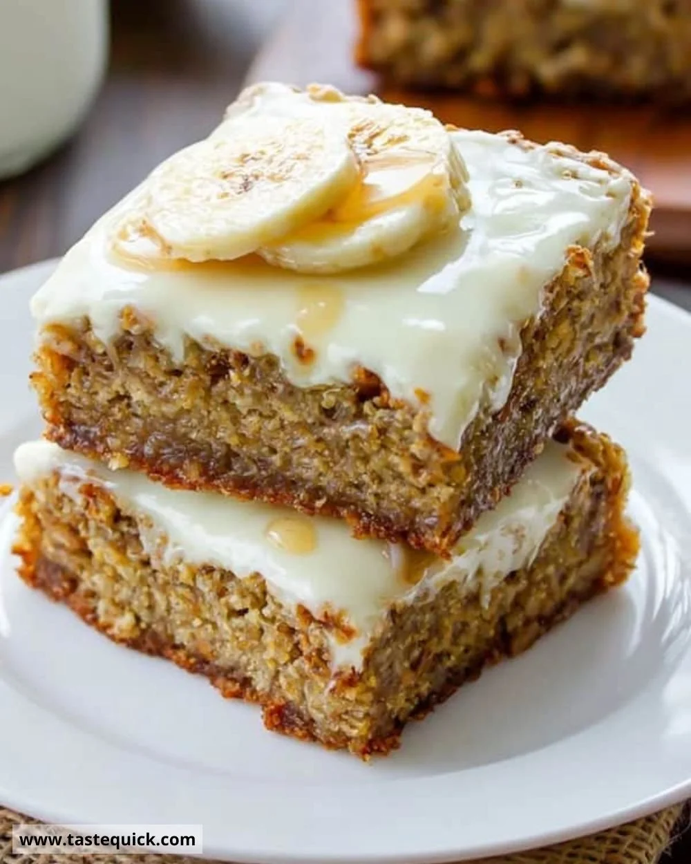Delicious banana bars with cream cheese frosting on a plate