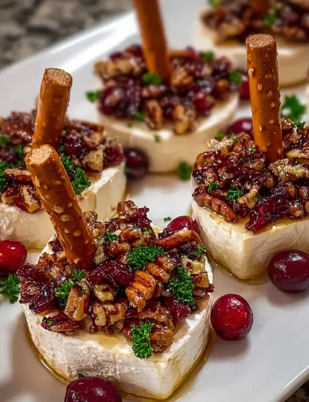 Delicious Candied Pecan Cranberry Brie Bites served on a platter