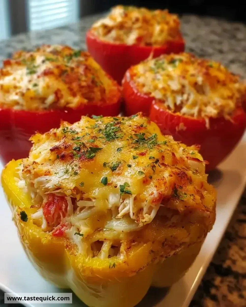 Crab and shrimp stuffed bell peppers served on a plate