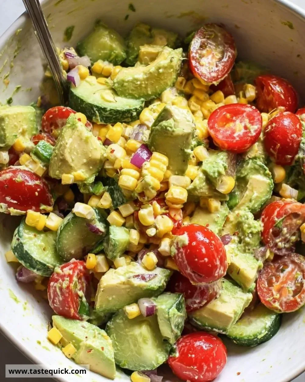 Easy avocado salad with corn and tomatoes in a bowl