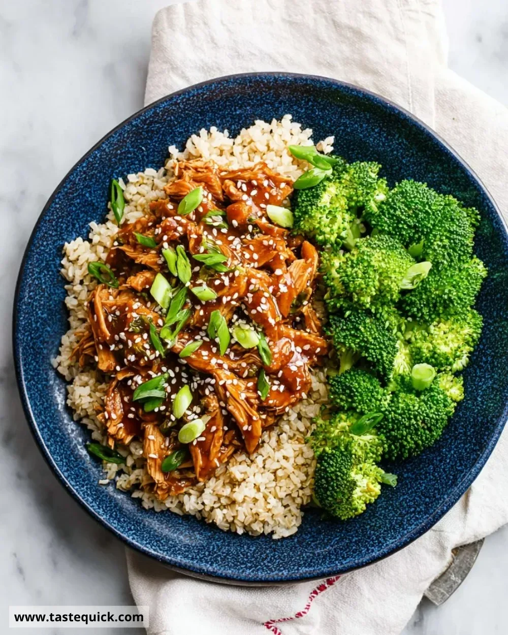 Delicious slow cooker honey garlic chicken garnished with sesame seeds