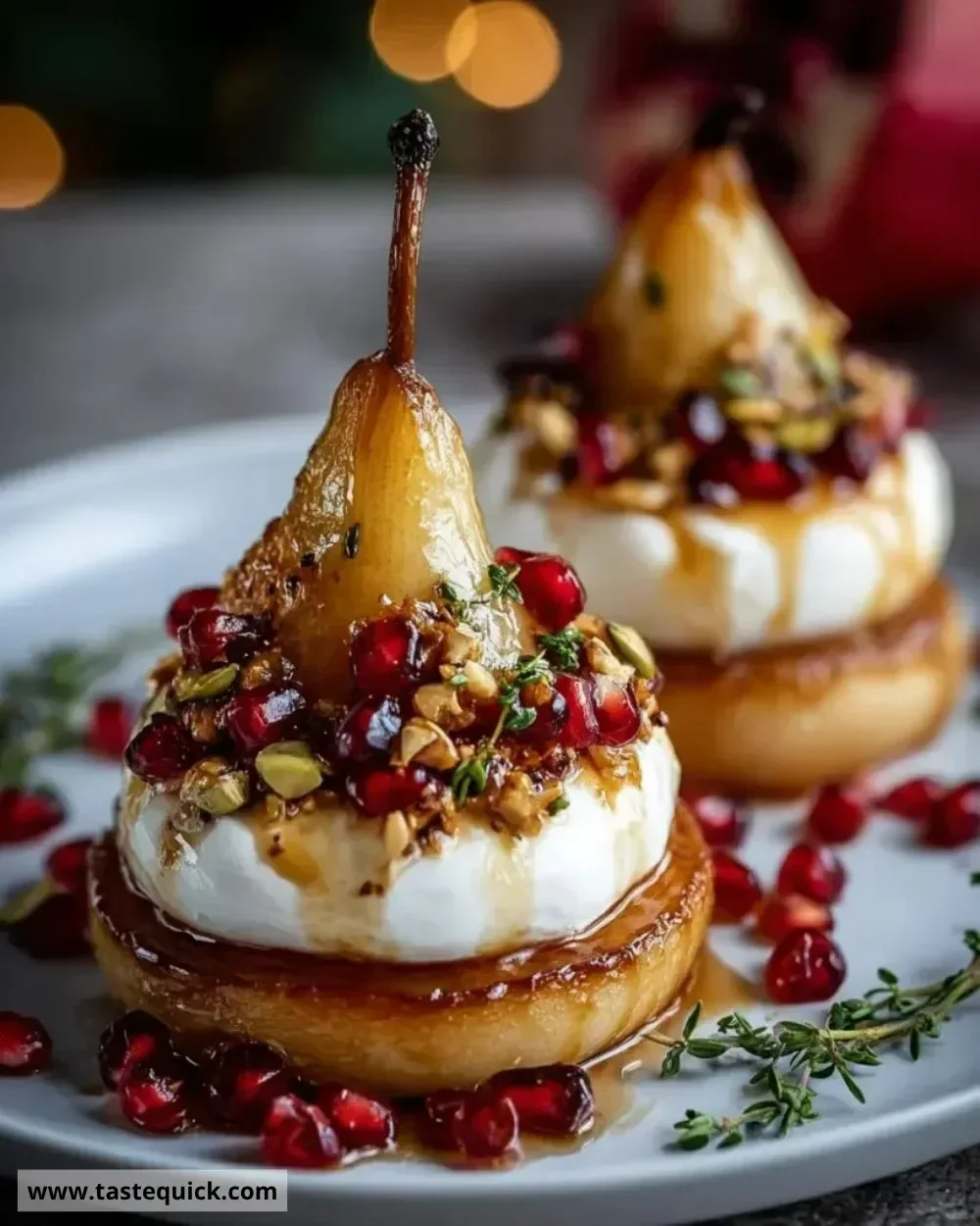 Golden caramelized pear and burrata towers served elegantly on a plate.