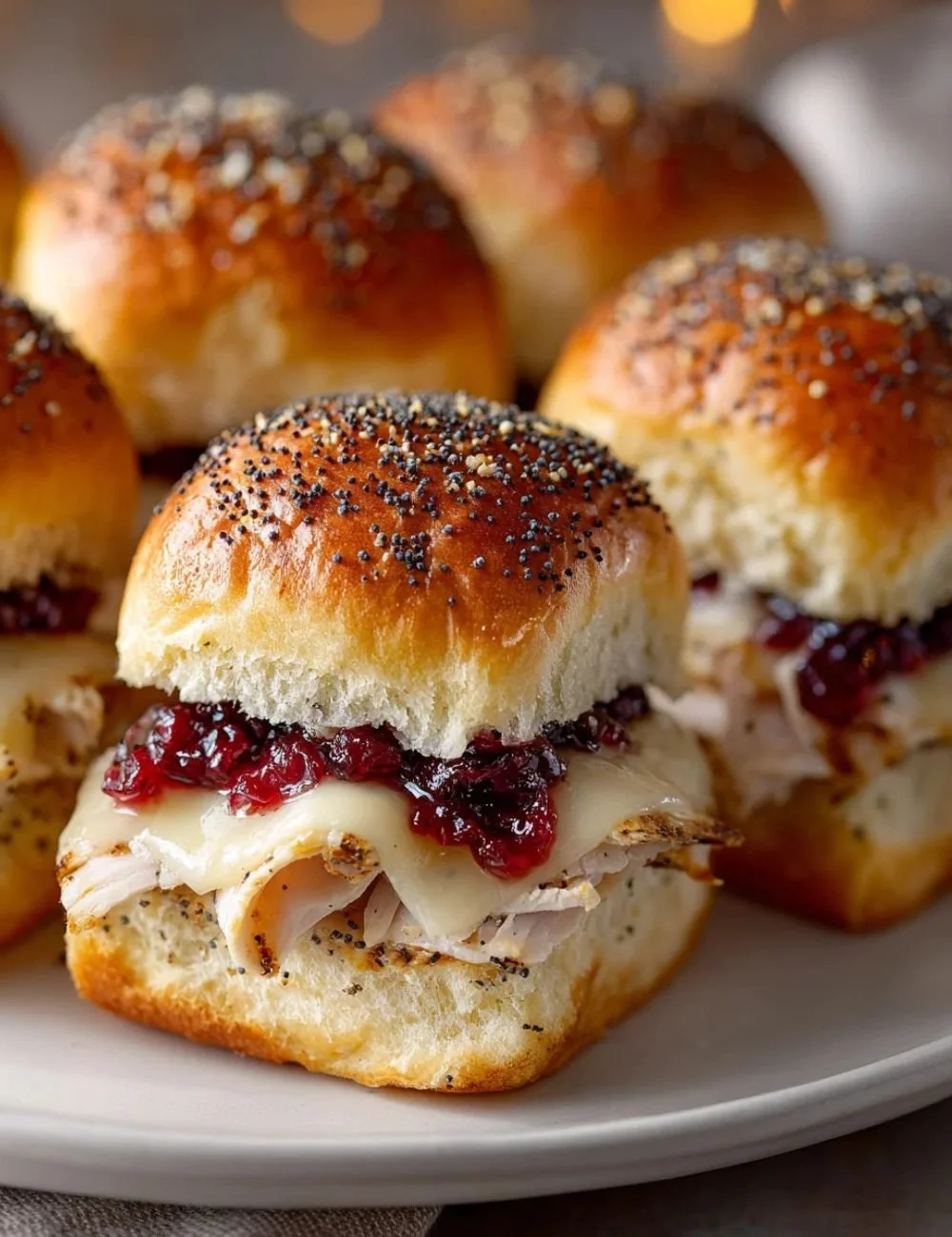 Delicious Havarti cranberry turkey sliders served on a platter