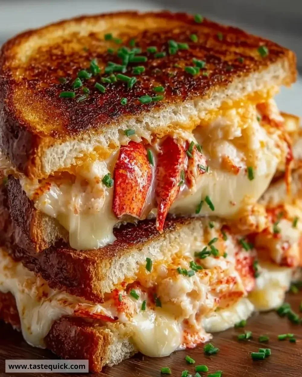 Delicious lobster grilled cheese sandwich with melted cheese and fresh lobster meat
