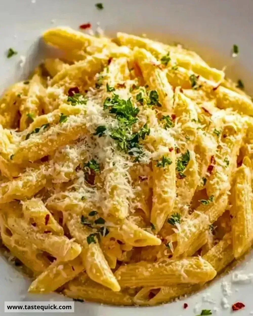 Delicious one pot creamy garlic pasta in a bowl, garnished with parsley.
