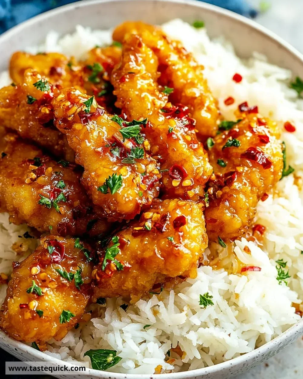 Delicious honey garlic chicken served on a plate with a side of vegetables.