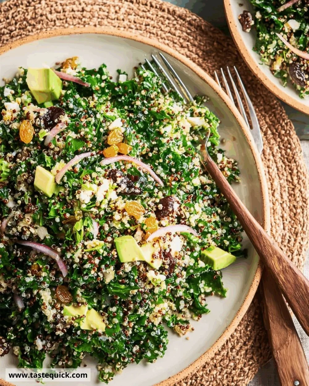 Fresh quinoa salad with shredded greens and raisins in a bowl