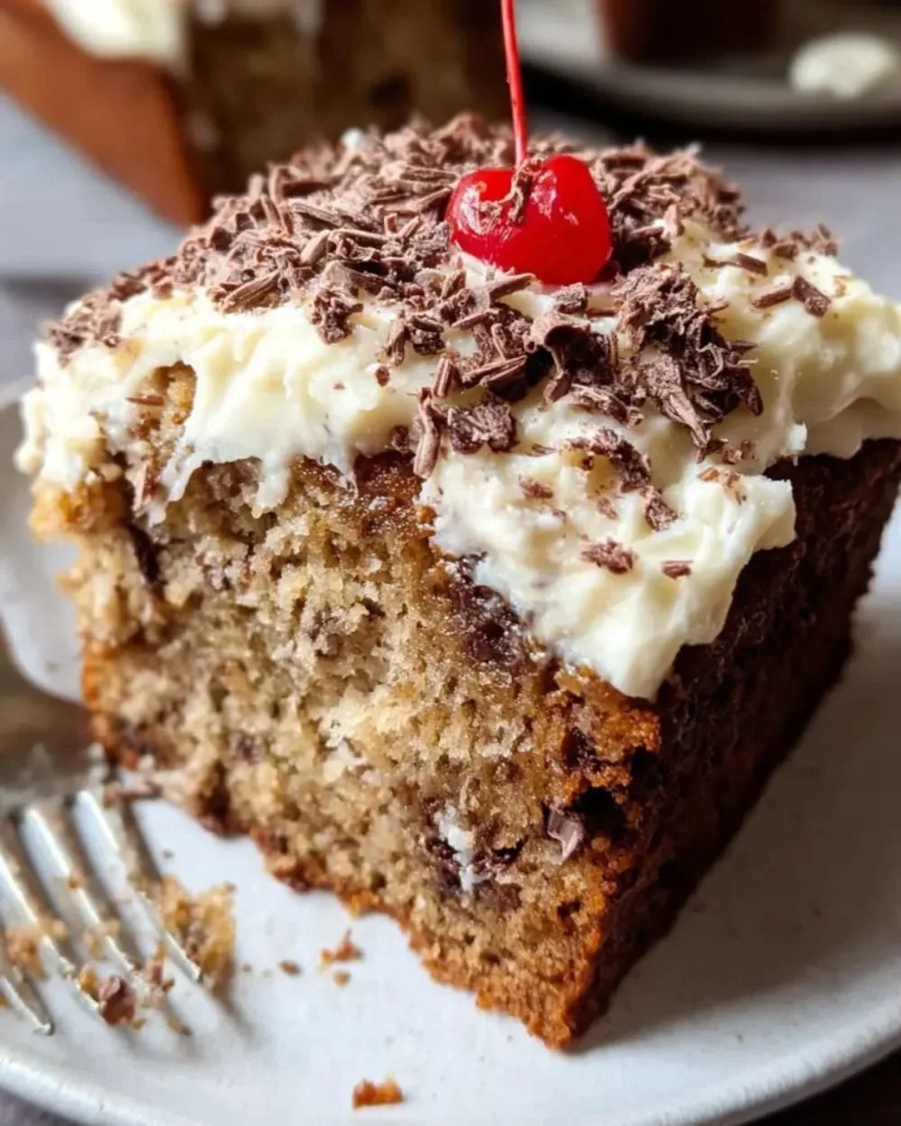 Rebel Float Frosted Banana Bread topped with creamy frosting and banana slices