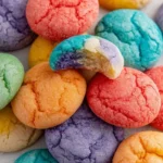 Vibrant fruity jello cookies in various colors on a white plate