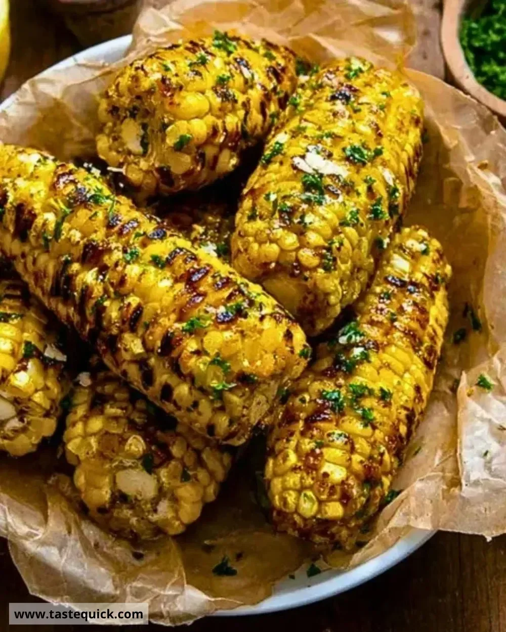 Viral cowboy butter roasted corn served on the cob with seasoning.