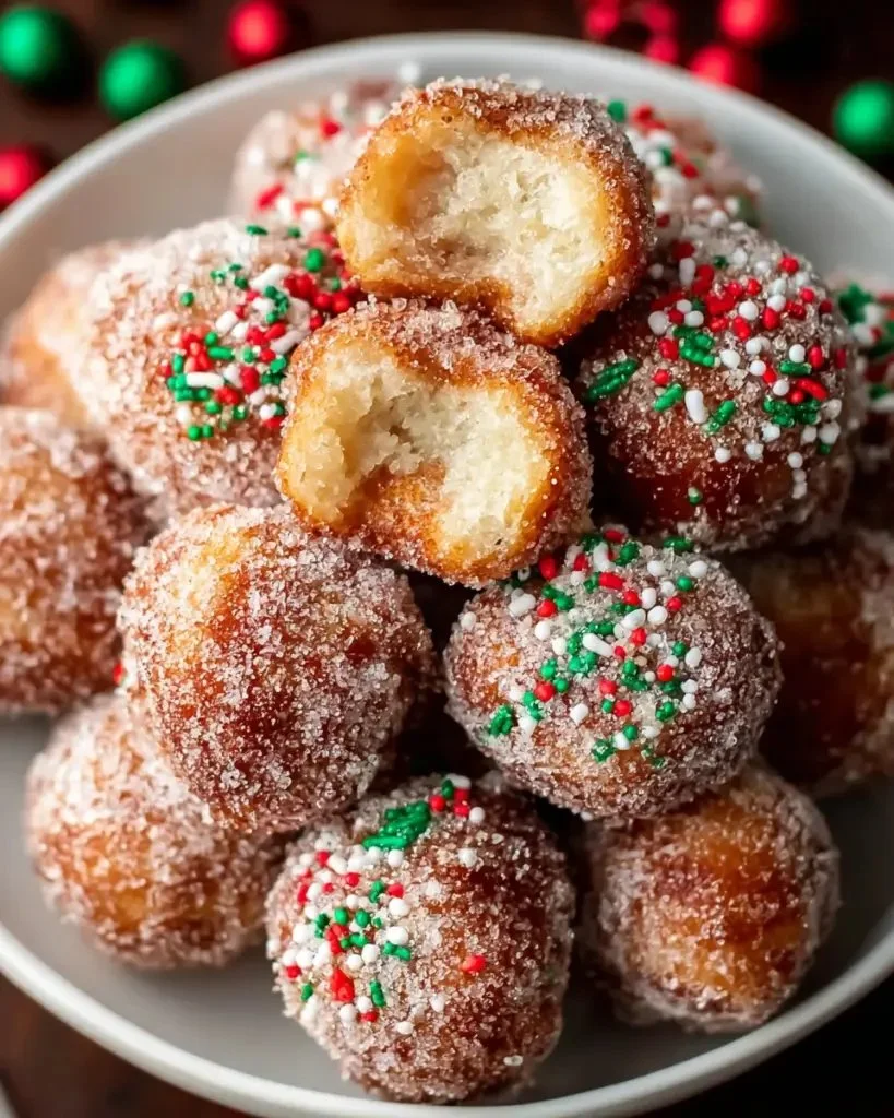 Festive Air Fryer Christmas donut holes on a holiday-themed plate
