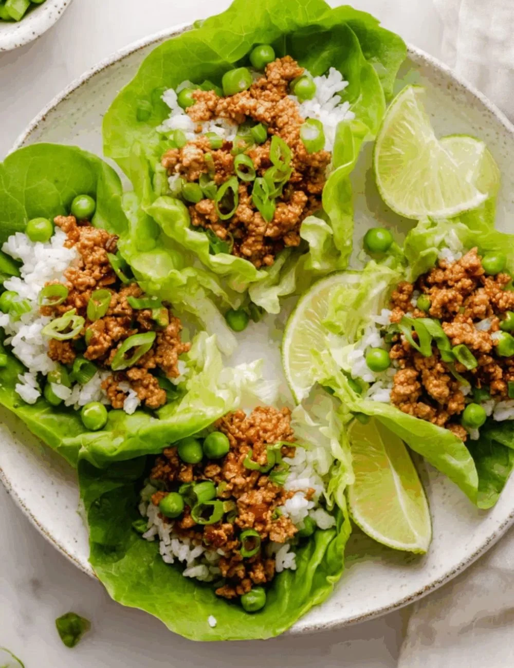 Savory Asian turkey lettuce wraps filled with fresh ingredients and herbs.