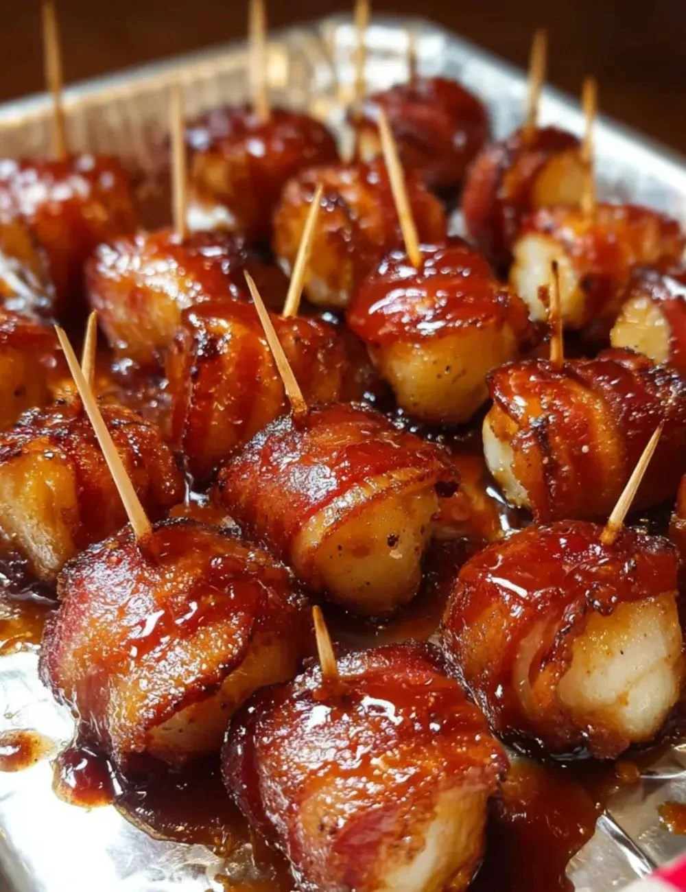 Delicious bacon wrapped water chestnuts appetizer on a serving platter