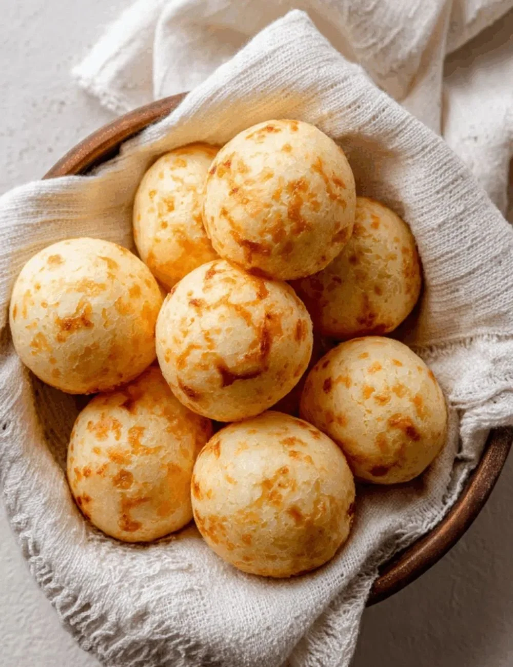 Delicious Brazilian cheese bread freshly baked with gooey cheese inside.