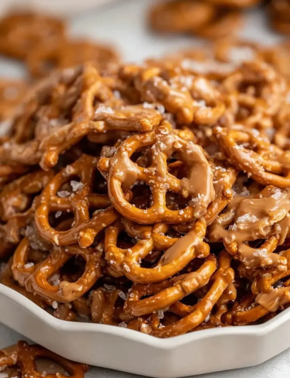 Delicious butter toffee pretzels on a plate, ready to enjoy.