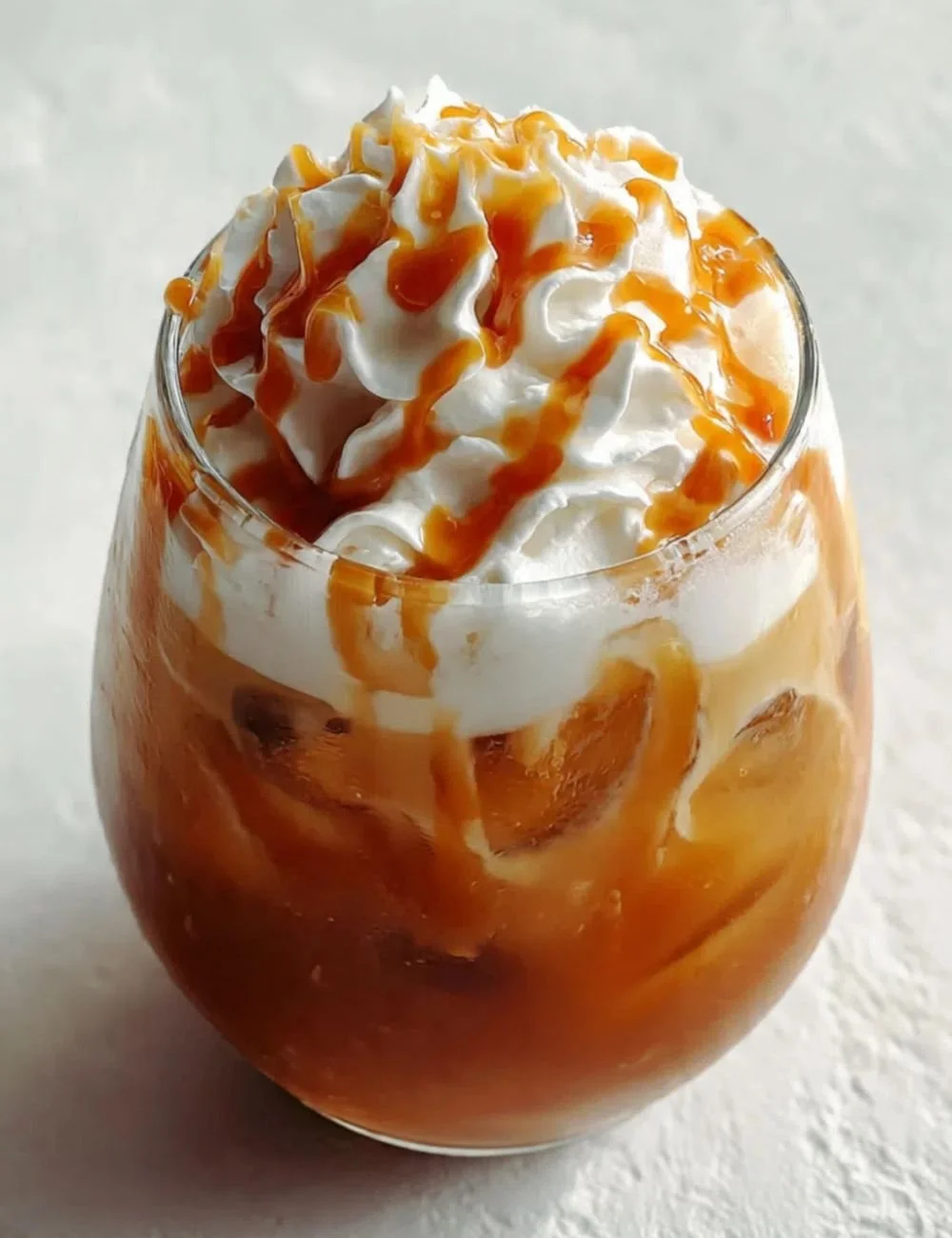 Delicious Caramel Apple Butter Mocktail in a glass with an apple slice garnish