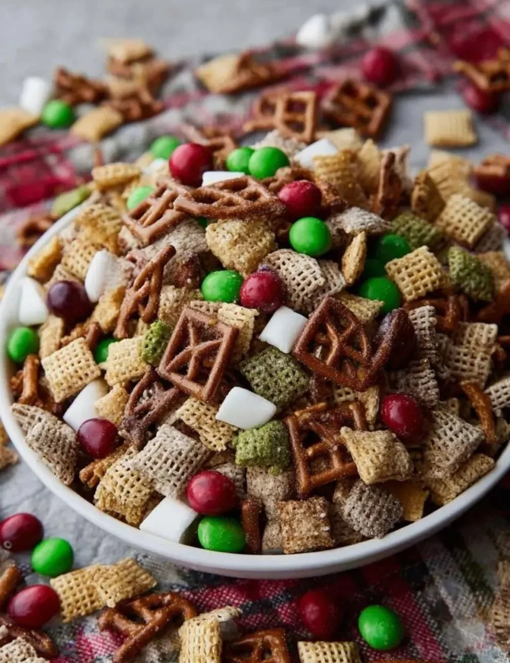 Delicious Chex Christmas Mix in a holiday bowl, perfect for festive snacking.