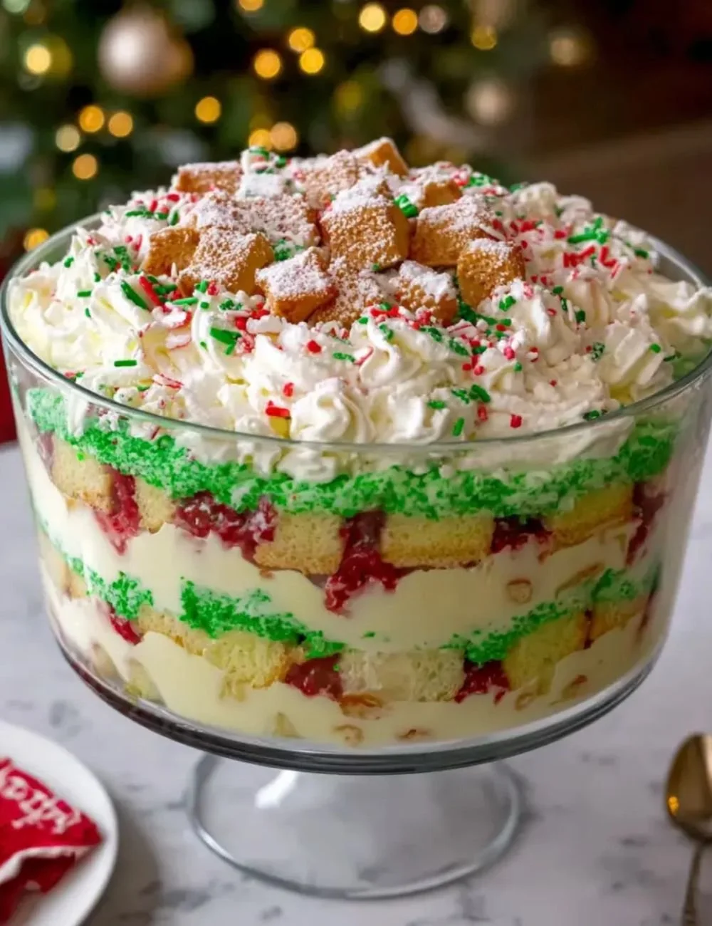 Christmas Tree Cake Trifle with layers of cake and festive decorations