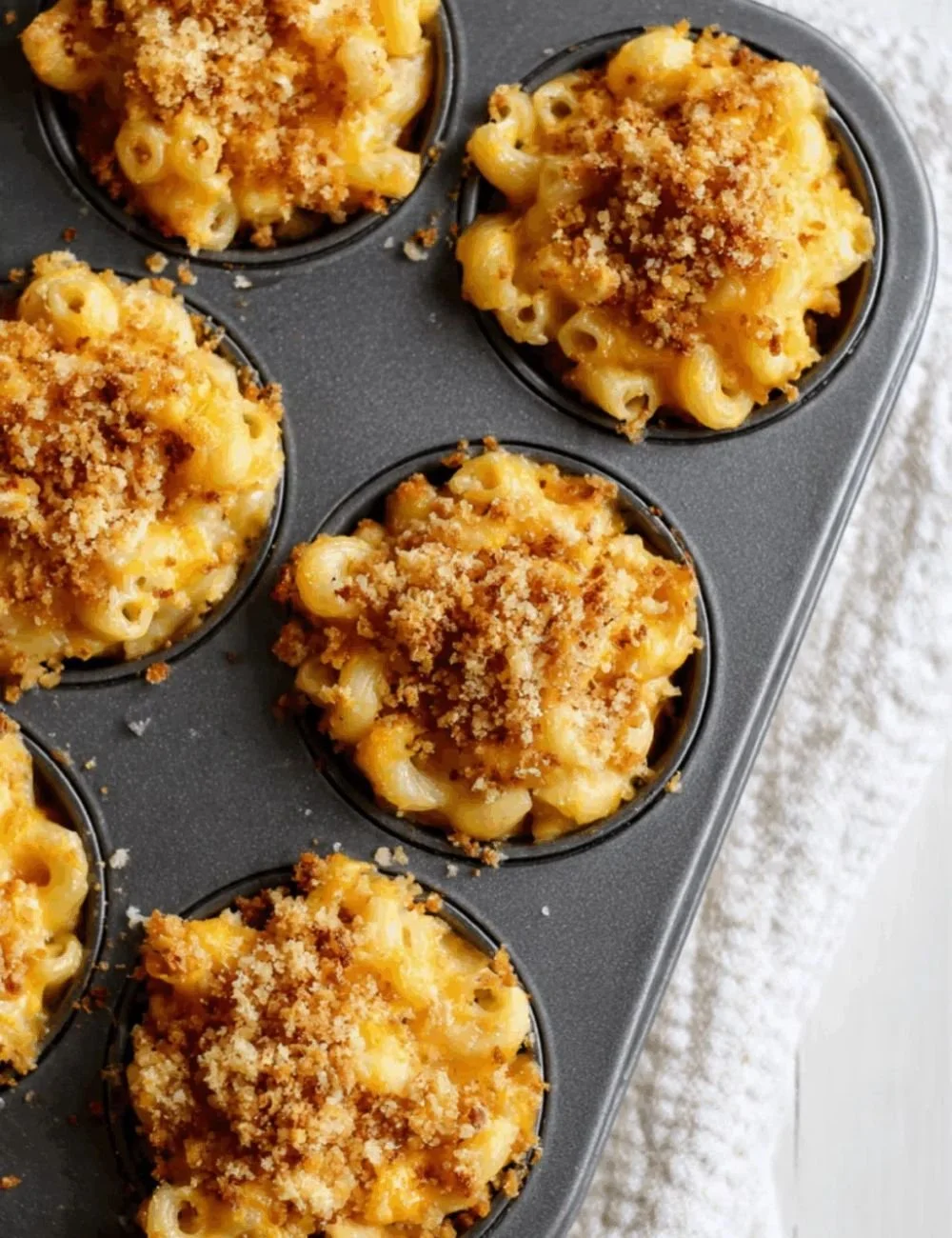 Crispy baked mac & cheese cups served in a baking dish