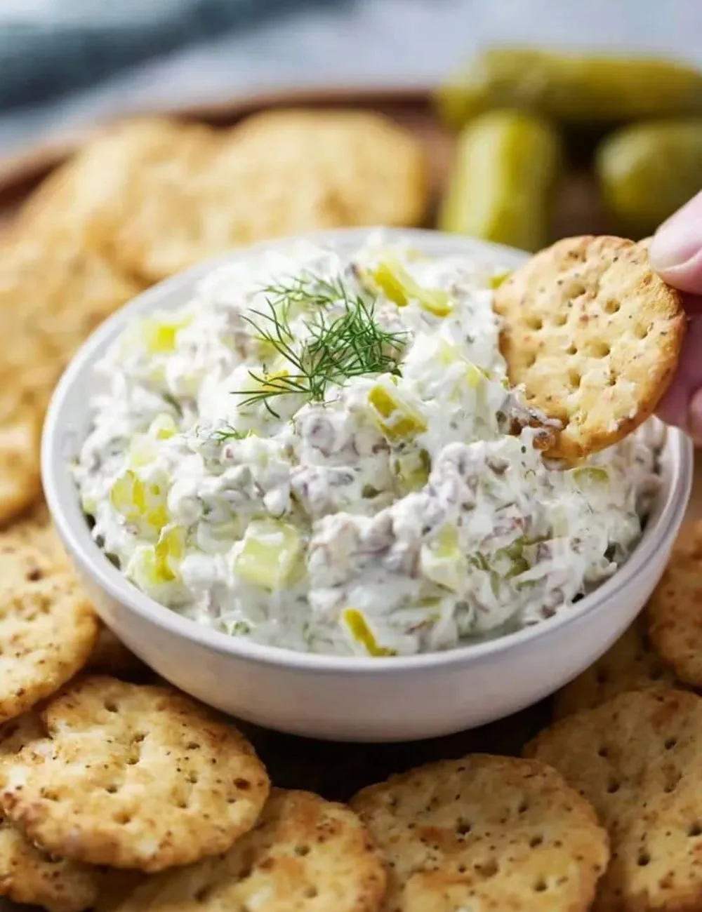 Creamy Dill Pickle Dip served in a bowl with fresh dill garnish