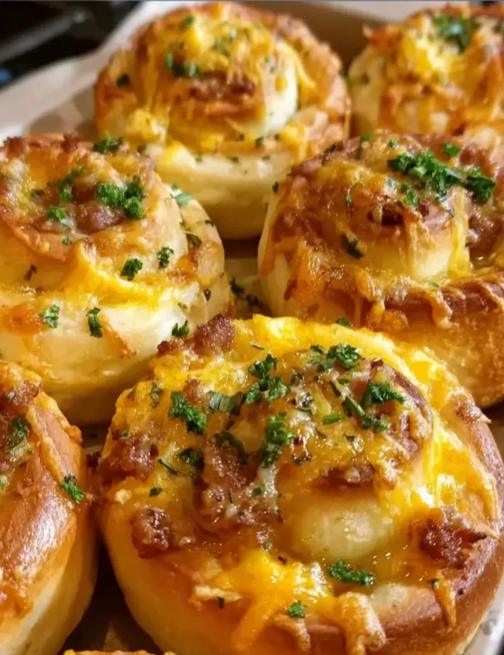 Easy cheesy breakfast rolls fresh out of the oven, perfect for a quick breakfast.