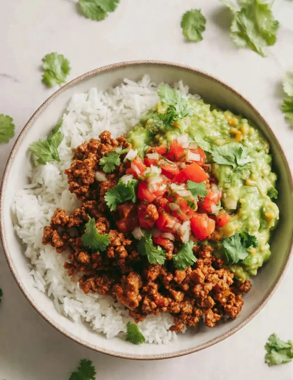 Ground Beef & Rice Cheddar Burrito Bowl with fresh toppings