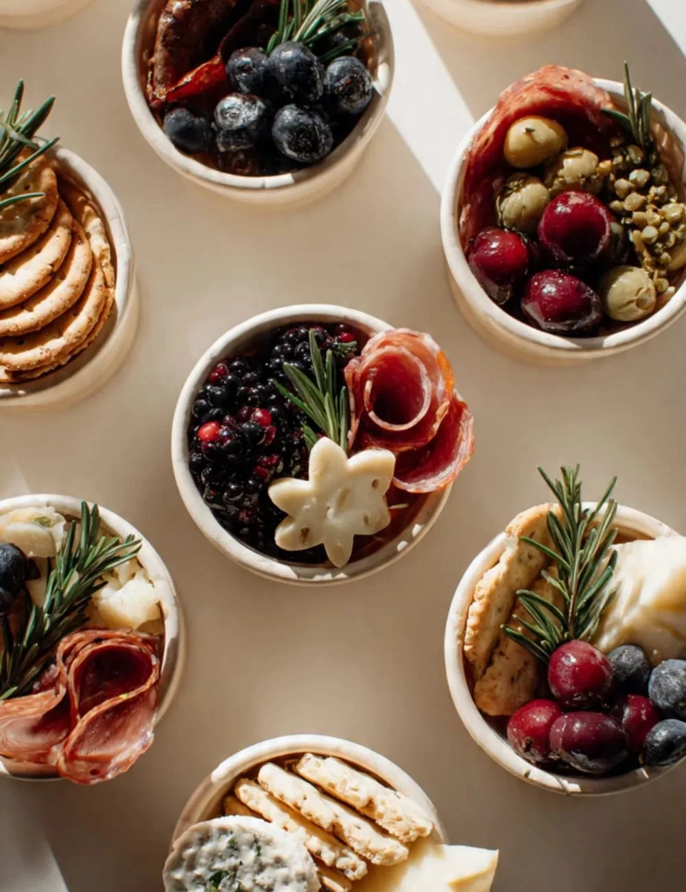 Festive holiday charcuterie cups filled with meats, cheeses, and fruits