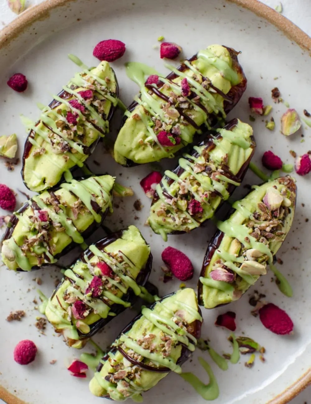 Matcha Cheesecake stuffed dates on a plate, showcasing a healthy dessert option.