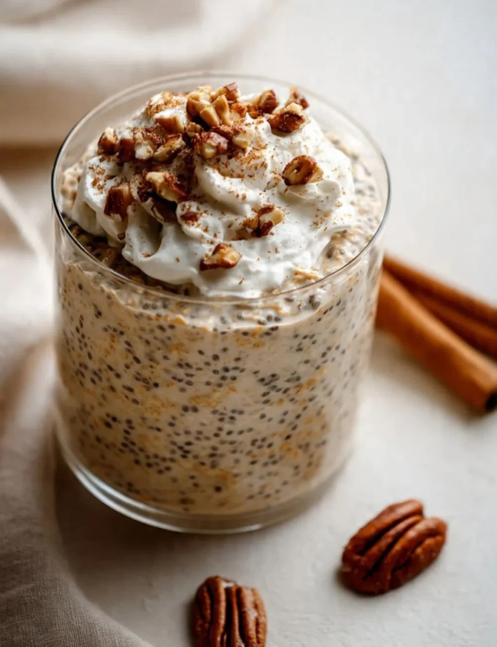 Bowl of Pumpkin Pie Overnight Oats topped with spices and pumpkin seeds