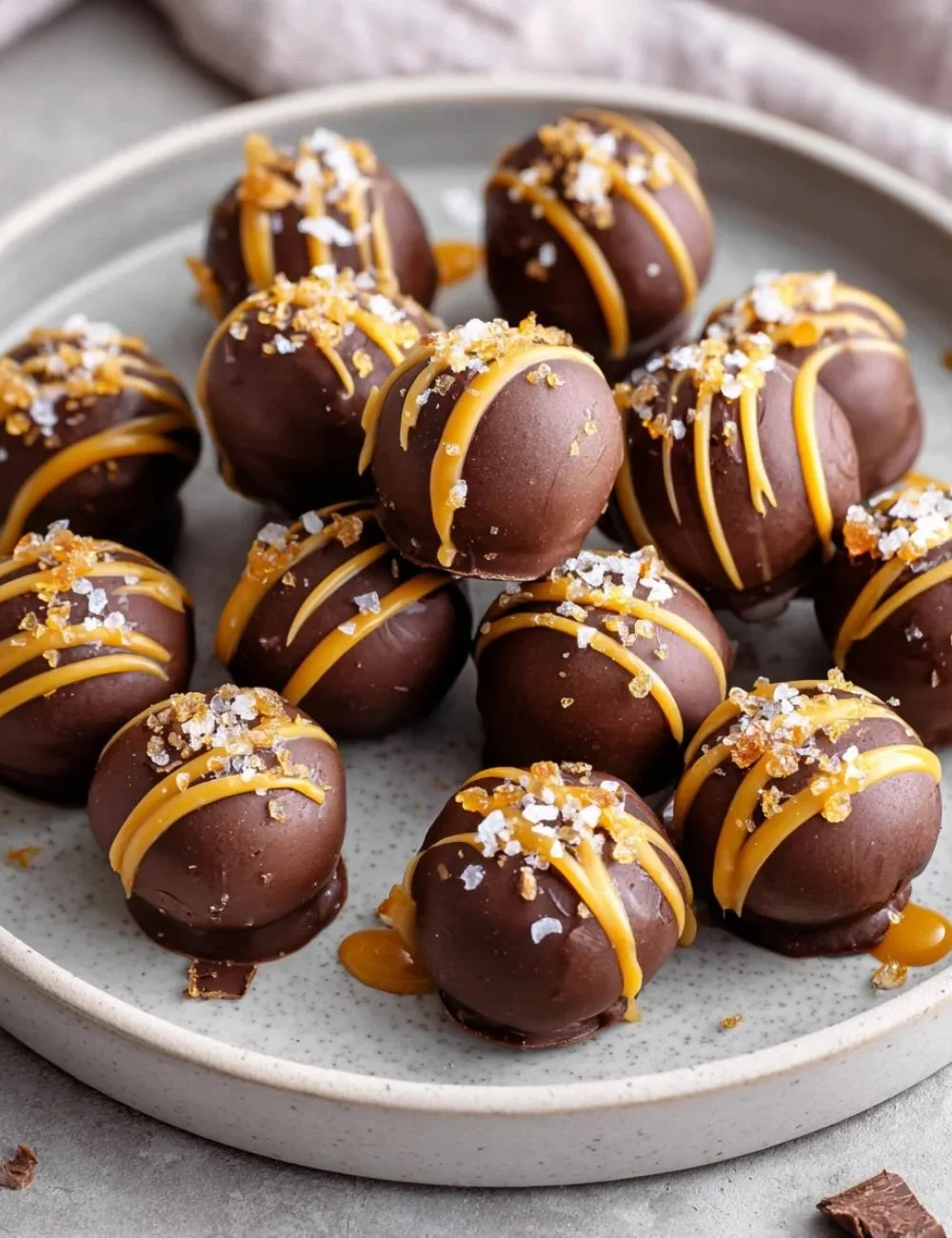 Delicious salted caramel fudge truffles arranged on a plate, tempting dessert treat